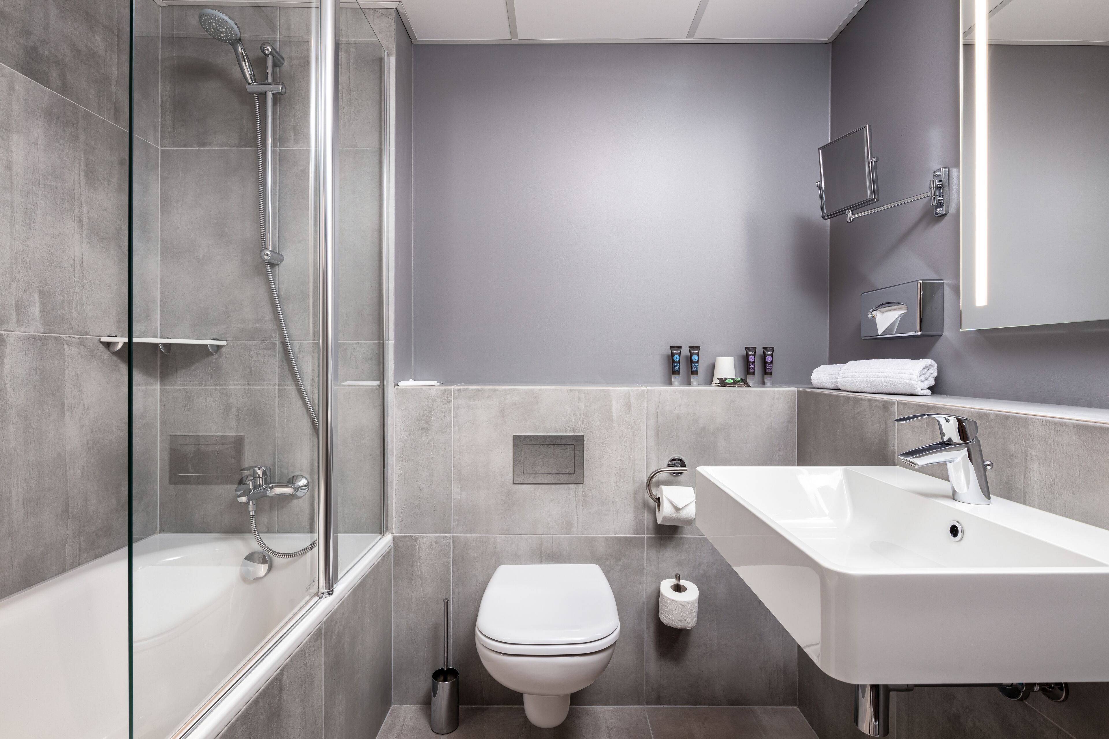 eco-friendly toiletries, hair dryer, towels