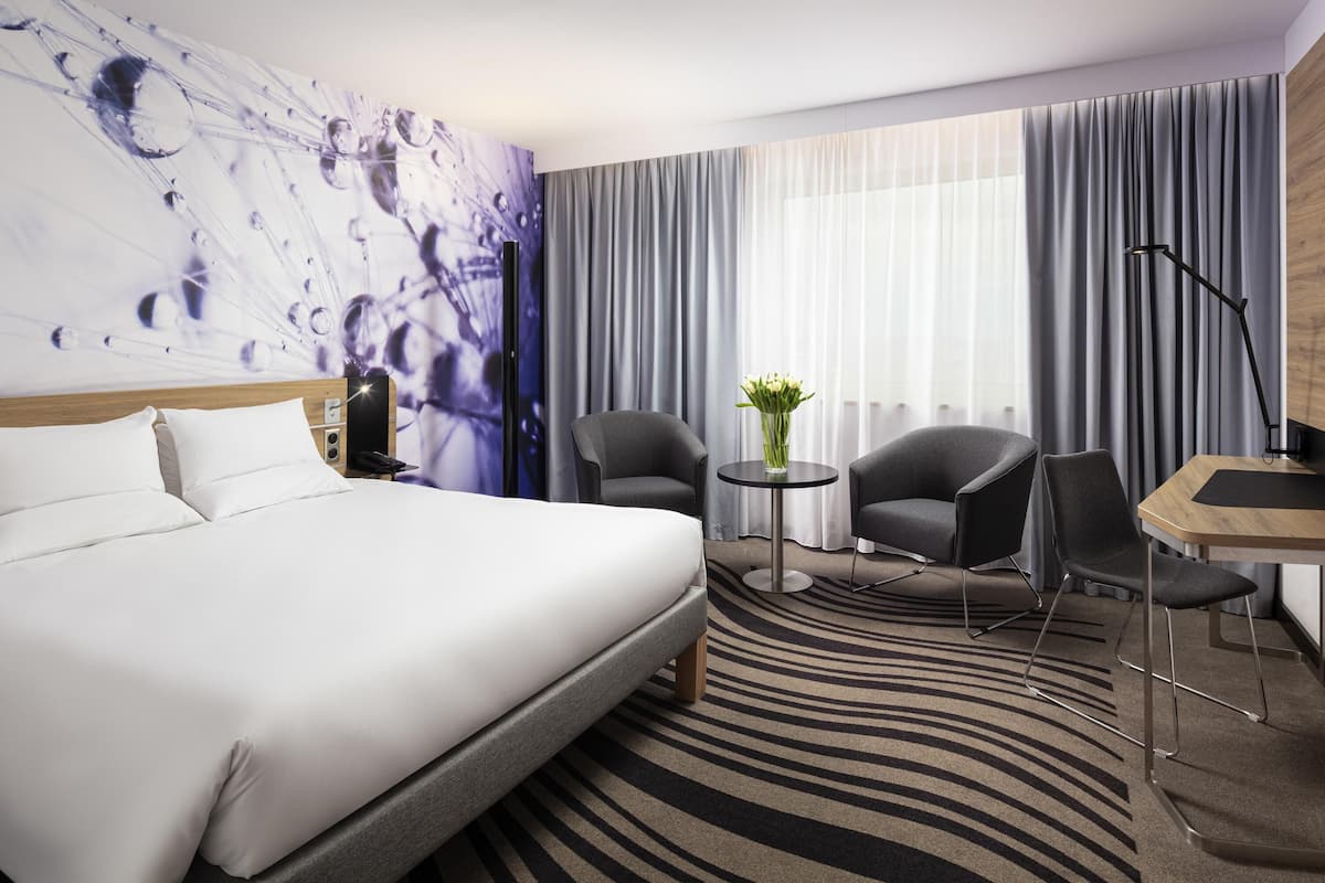 Hypo-allergenic bedding, desk, laptop workspace, blackout curtains