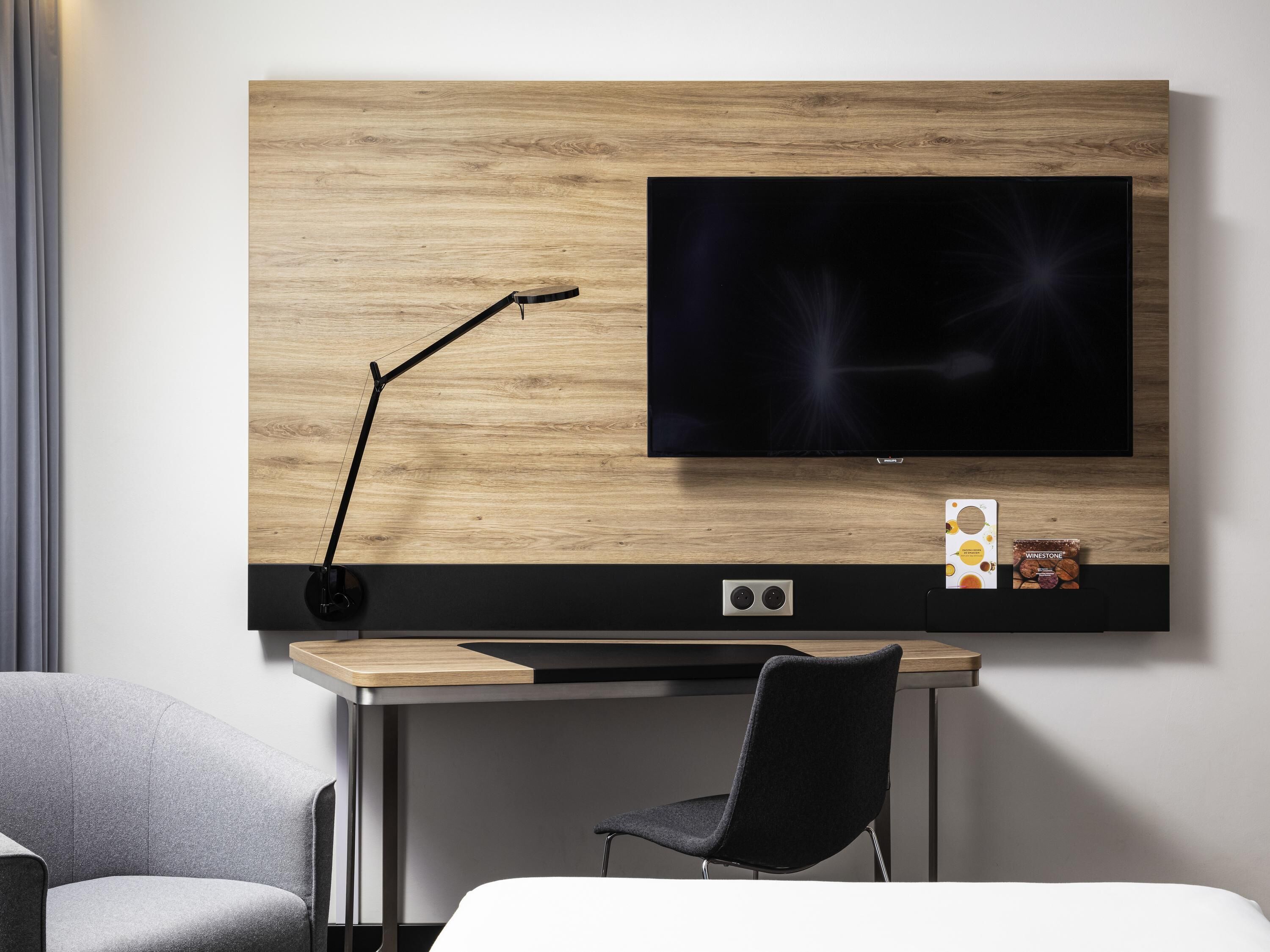 Hypo-allergenic bedding, desk, laptop workspace, blackout curtains