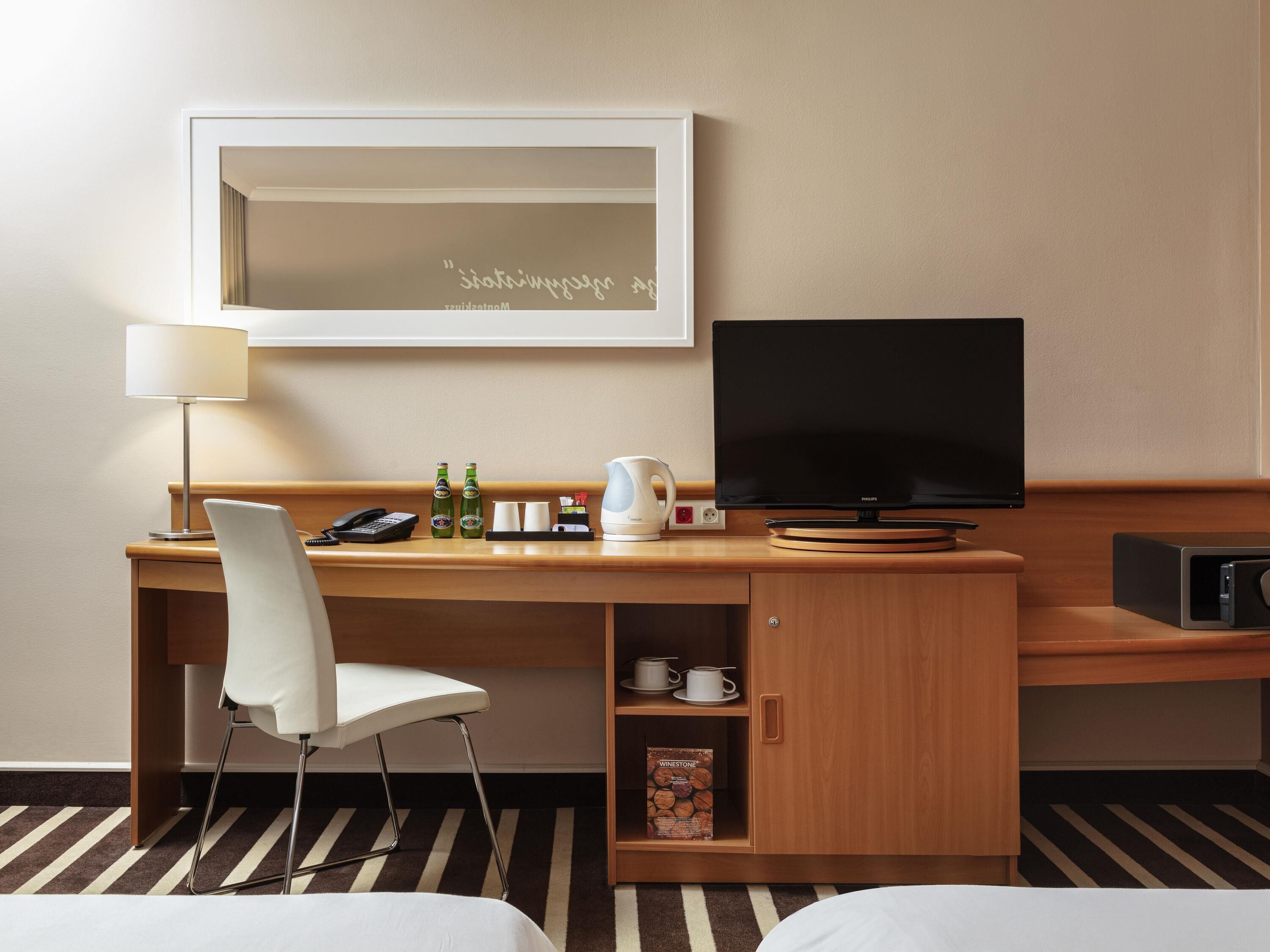 Hypo-allergenic bedding, desk, laptop workspace, blackout curtains