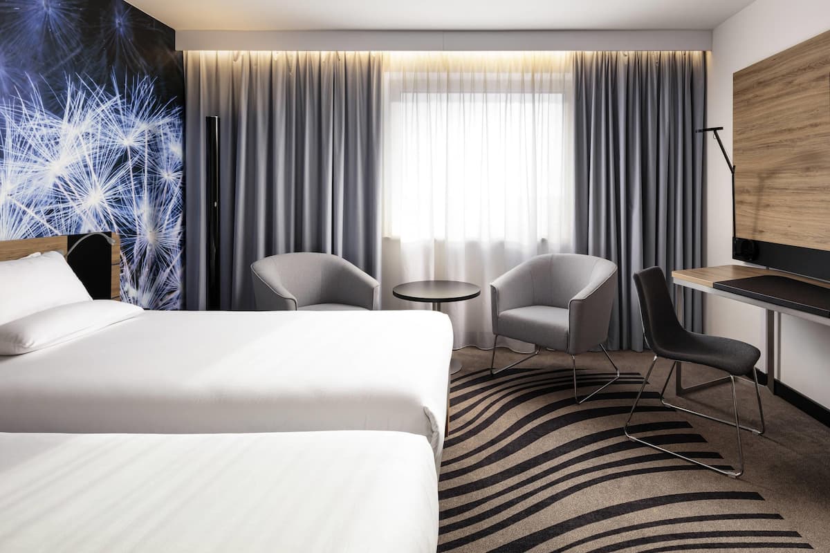 Hypo-allergenic bedding, desk, laptop workspace, blackout drapes