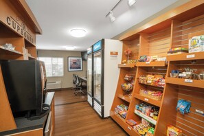 A kitchenette area with a refrigerator, microwave, and coffee machine. - Candlewood Suites Hopewell - Fort Lee by IHG (Hopewell)