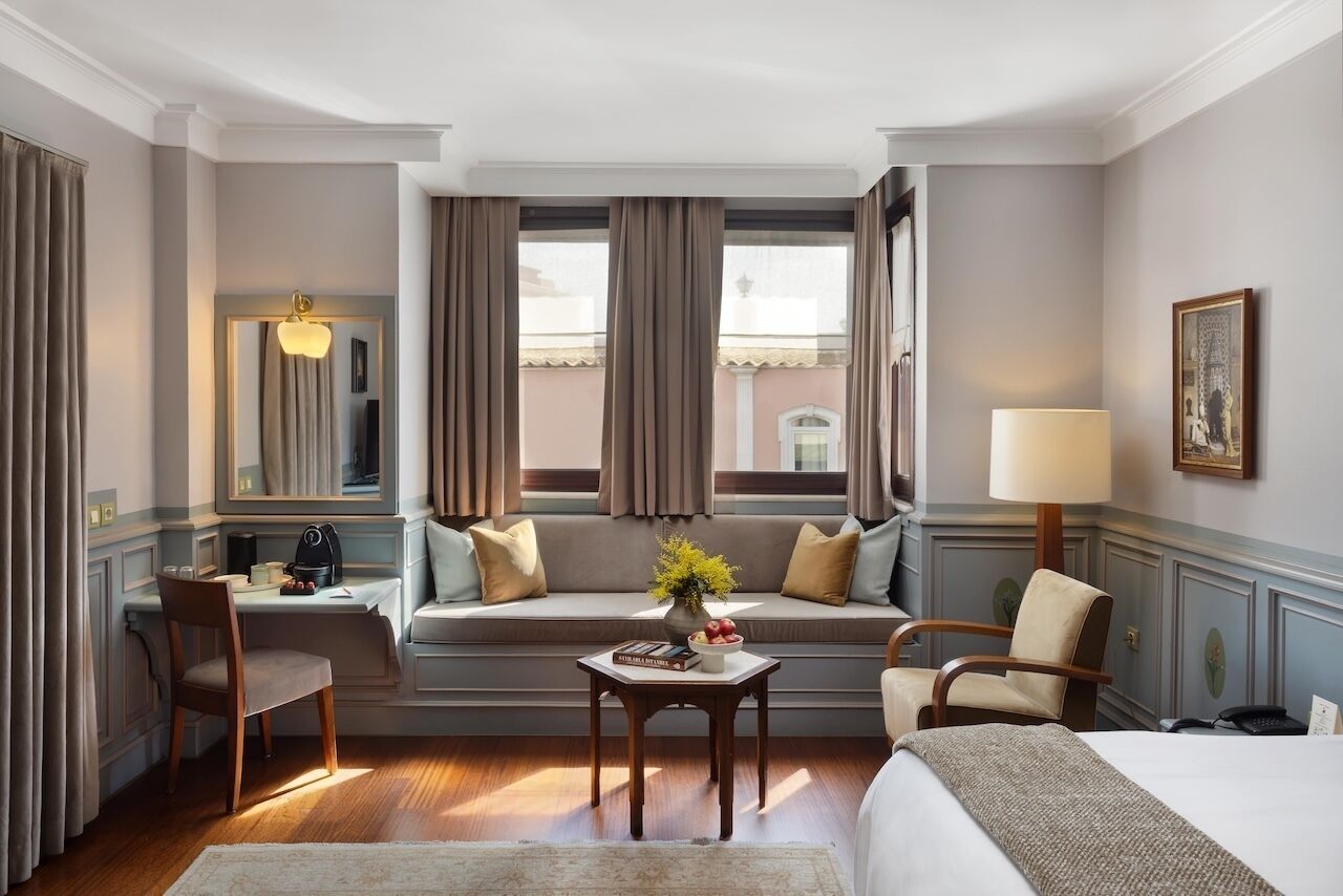 Junior Suite | Minibar, in-room safe, individually decorated, desk