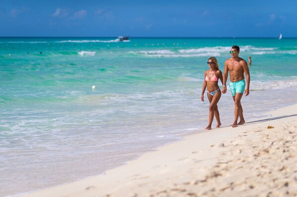 Private beach, white sand, sun loungers, beach umbrellas
