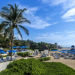 Private beach, white sand, sun loungers, beach umbrellas