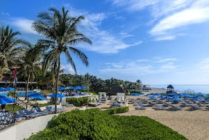 Private beach, white sand, sun loungers, beach umbrellas