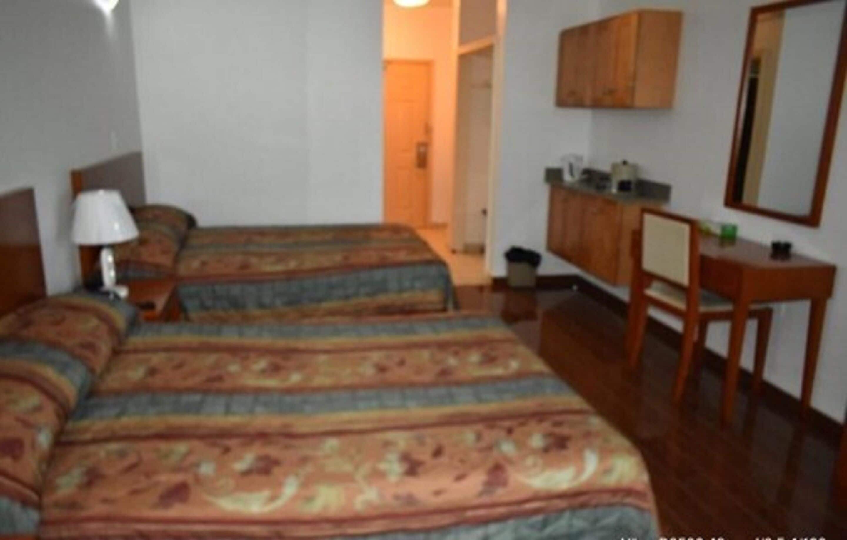 standard double room, 2 double beds | in-room safe, desk, iron/ironing board, wifi