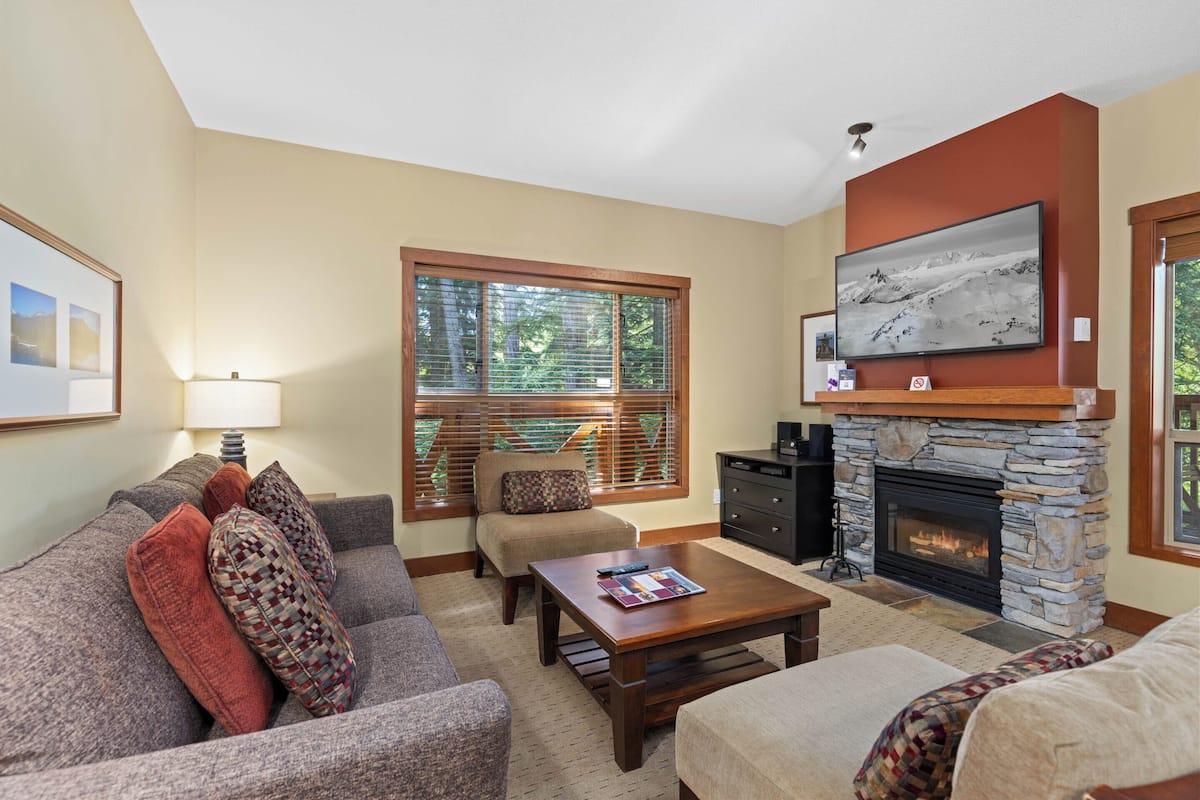 Two Bedroom #105 | Living area | 55-inch flat-screen TV with cable channels, Smart TV, fireplace