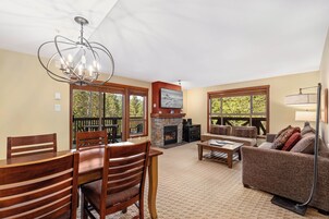 One Bedroom #204 | Living area | 55-inch flat-screen TV with cable channels, Smart TV, fireplace