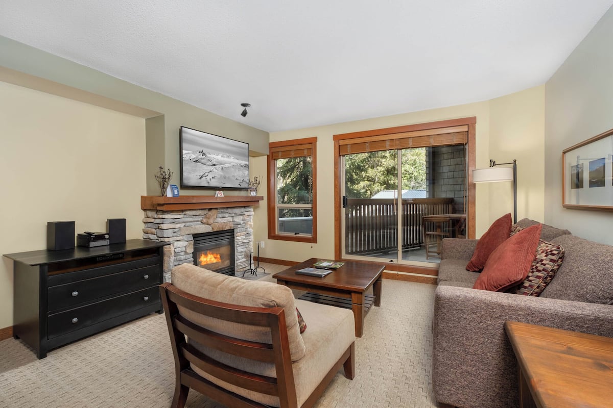 One Bedroom #203 | Living area | 55-inch flat-screen TV with cable channels, Smart TV, fireplace