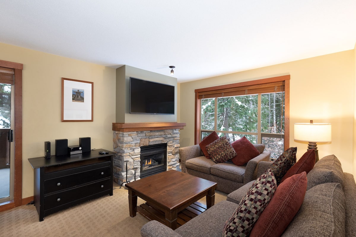 Three Bedroom Unit 206 | Living area | 55-inch flat-screen TV with cable channels, Smart TV, fireplace