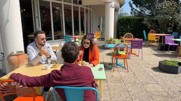 Relax in a casual, open-air setting with tables and chairs for groups of all sizes.