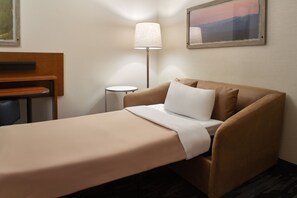 Premium bedding, desk, laptop workspace, blackout curtains