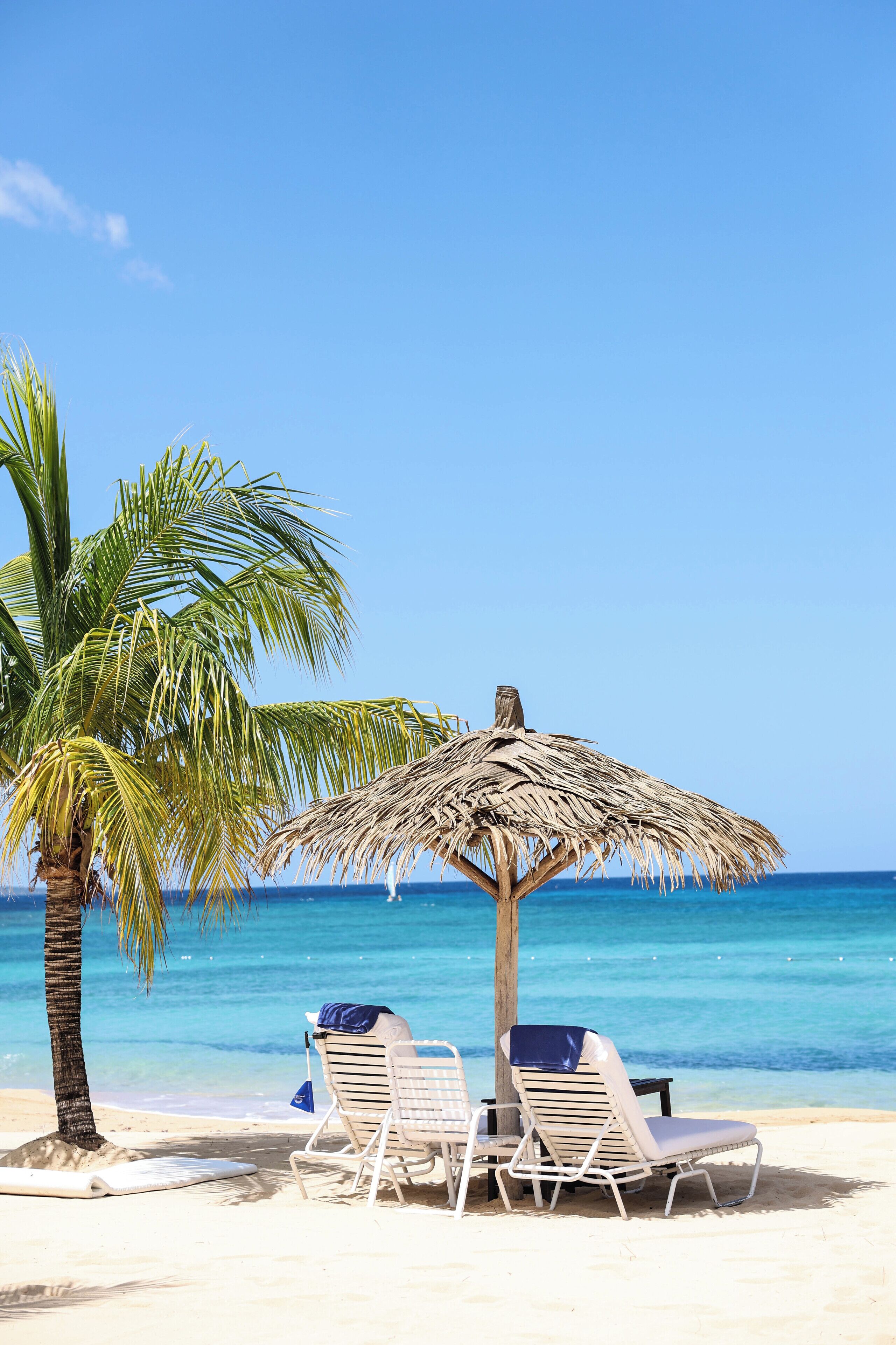 On the beach, sun loungers, beach umbrellas, beach towels