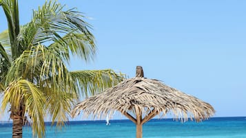 On the beach, sun loungers, beach umbrellas, beach towels