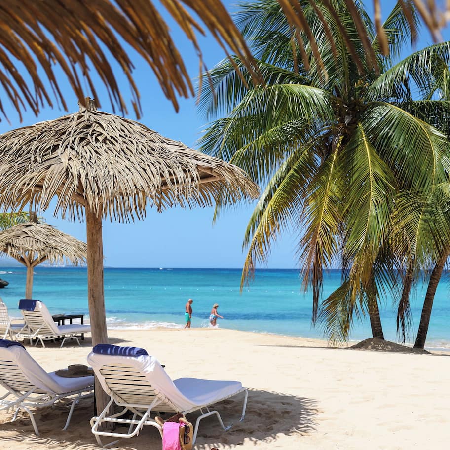 On the beach, sun loungers, beach umbrellas, beach towels