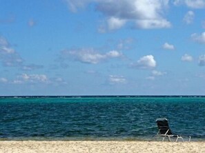 On the beach, sun loungers, beach umbrellas, beach towels