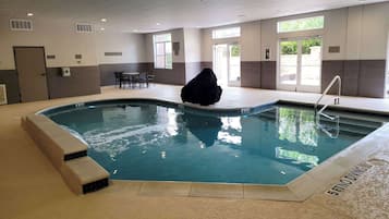 Indoor pool, open 6:00 AM to midnight, pool loungers