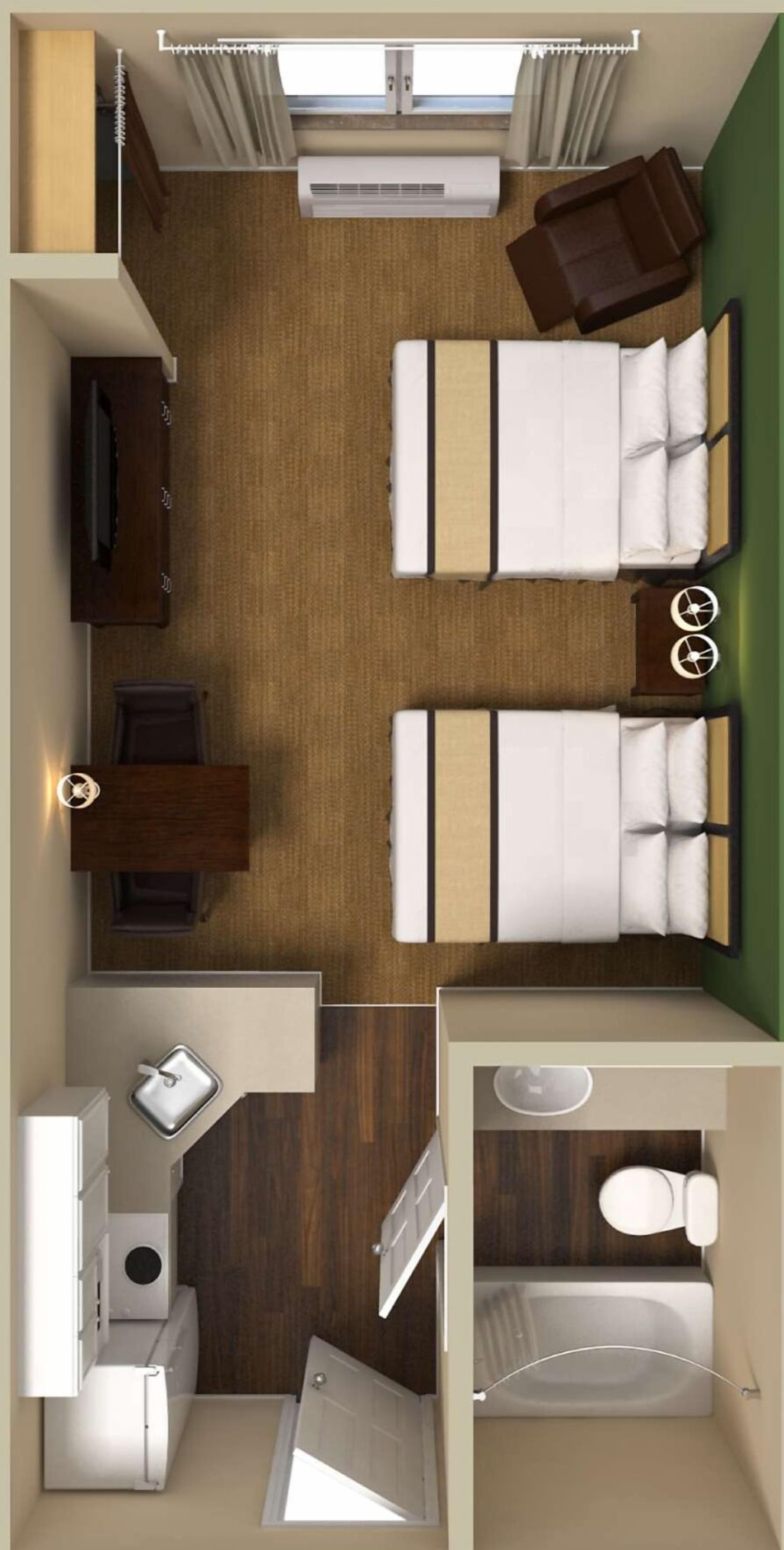 Une chambre d’hôtel avec deux lits, un bureau, une chaise, une télévision et une salle de bain équipée d’une baignoire et de toilettes.