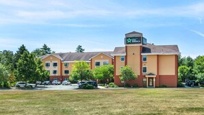 A Holiday Inn Express hotel with a central tower, multiple buildings, and a parking lot. - Extended Stay America Suites Portland Scarborough (Scarborough)
