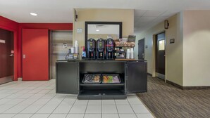 A coffee station with multiple coffee dispensers and a tray of snacks. - Extended Stay America Suites Stockton March Lane (Stockton)
