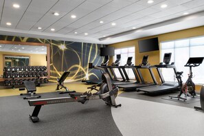 A gym with treadmills, stationary bikes, and weight machines. - Hilton Garden Inn Rock Hill (Rock Hill)
