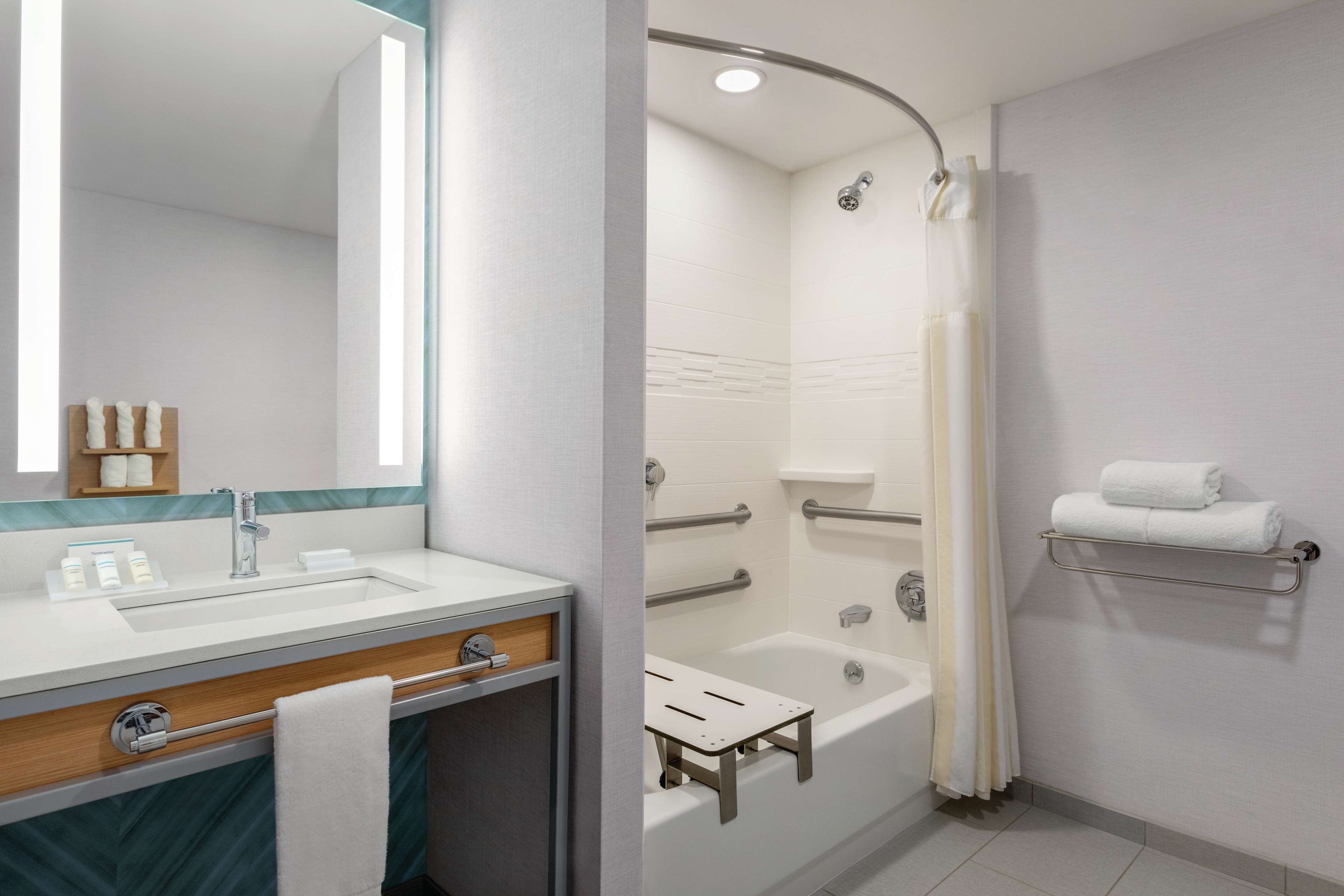 shower, rainfall showerhead, hair dryer, towels