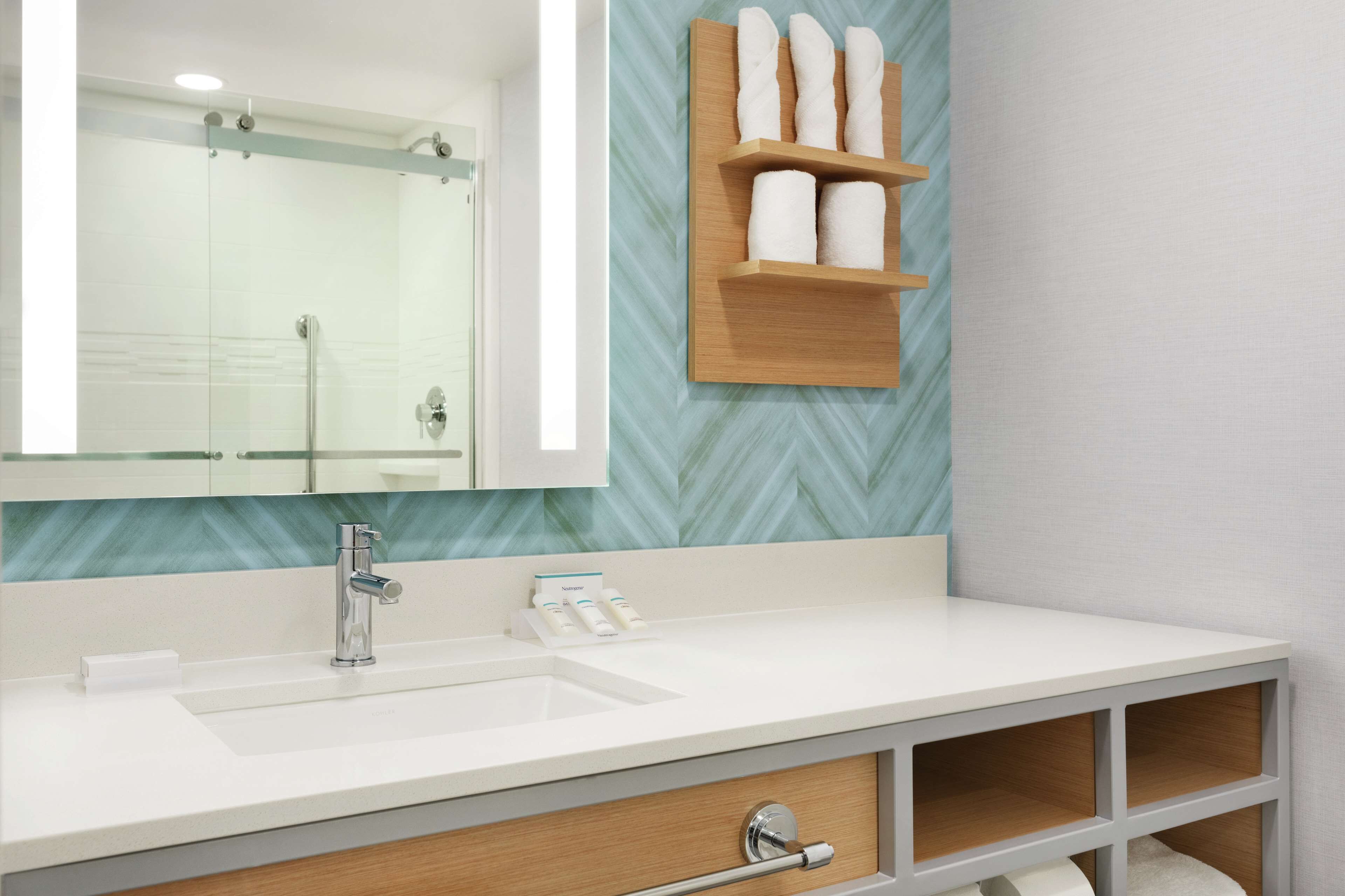 shower, rainfall showerhead, hair dryer, towels