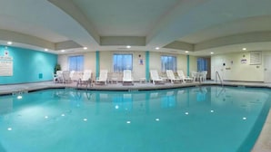 An indoor swimming pool with clear water, surrounded by white lounge chairs and a 'No Diving' sign. - Holiday Inn Express & Suites Quakertown - Allentown Area by IHG (Quakertown)
