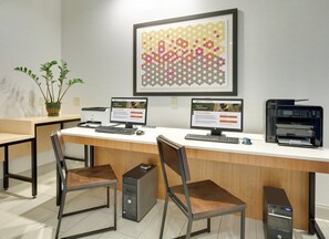 A modern office space with two desktop computers, a printer, and two chairs. - Holiday Inn Express & Suites Dublin by IHG (Dublin)