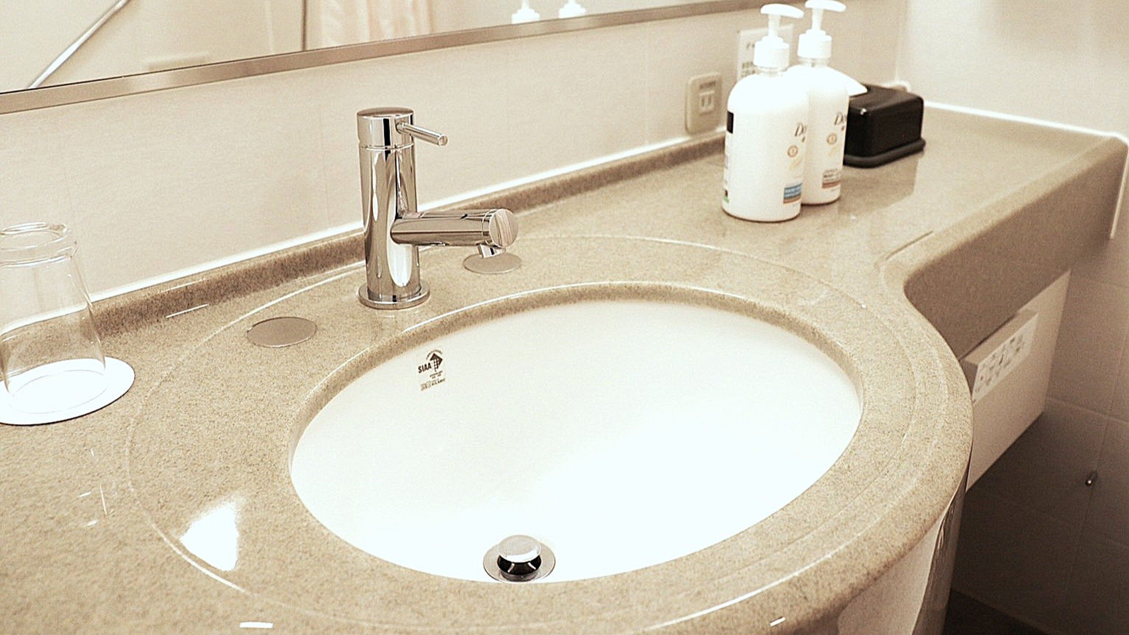 combined shower/bathtub, free toiletries, hair dryer, slippers