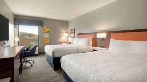 A hotel room with two beds, a desk, a chair, and a large window with a view. - Hampton Inn Waynesboro/Stuarts Draft (Fishersville)