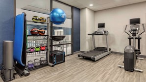 A gym with a treadmill, elliptical, and various weights and exercise balls. - Hampton Inn Waynesboro/Stuarts Draft (Fishersville)