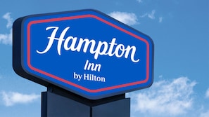 A blue sign with "Hampton Inn by Hilton" written on it. - Hampton Inn Dublin (Dublin)