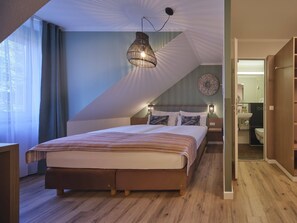 Comfort Room | Hypo-allergenic bedding, desk, blackout drapes, iron/ironing board