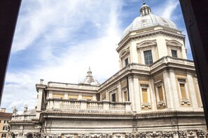 A historic building with classical architecture, featuring a prominent dome and detailed stonework. - Antico Palazzo Rospigliosi (Rome)