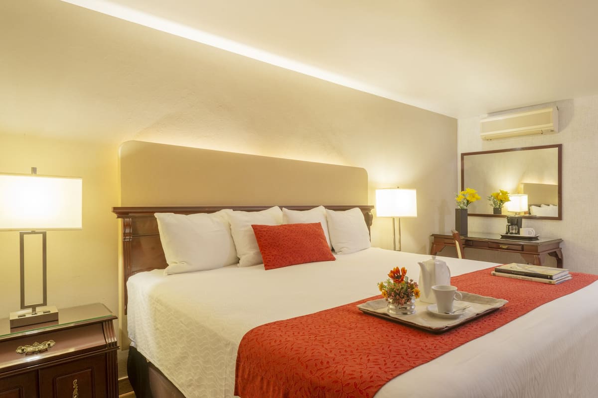 Standard, One King Bed | In-room safe, blackout curtains, free WiFi, bed sheets