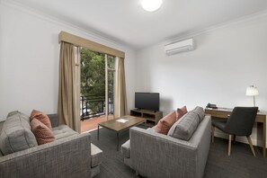 Standard Two Bedroom Apartment | Living area | 32-inch TV with digital channels, DVD player