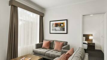 Standard Two Bedroom Apartment | Living area | 32-inch TV with digital channels, DVD player