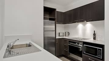 Standard Two Bedroom Apartment | Private kitchen | Fridge, microwave, stovetop, dishwasher