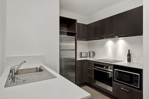 Standard Two Bedroom Apartment | Private kitchen | Fridge, microwave, stovetop, dishwasher