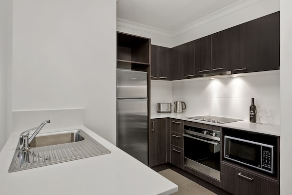 Standard Two Bedroom Apartment | Private kitchen | Fridge, microwave, stovetop, dishwasher