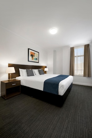 Executive One Bedroom Apartment | Desk, iron/ironing board, cribs/infant beds, rollaway beds