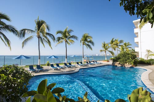 Outdoor pool, open 9:00 AM to 8:00 PM, pool umbrellas