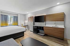 Suite, 1 King Bed, Accessible, Non Smoking (Bathtub w/ Grab Bars) | Desk, laptop workspace, blackout drapes, iron/ironing board