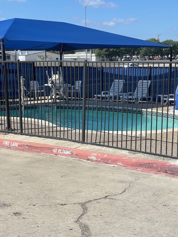 Outdoor pool, open 9:00 AM to 9:00 PM, pool loungers