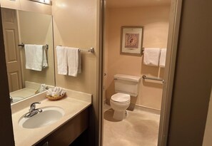 Suite, 1 King Bed, Non Smoking | Bathroom | Hair dryer, towels, soap, shampoo