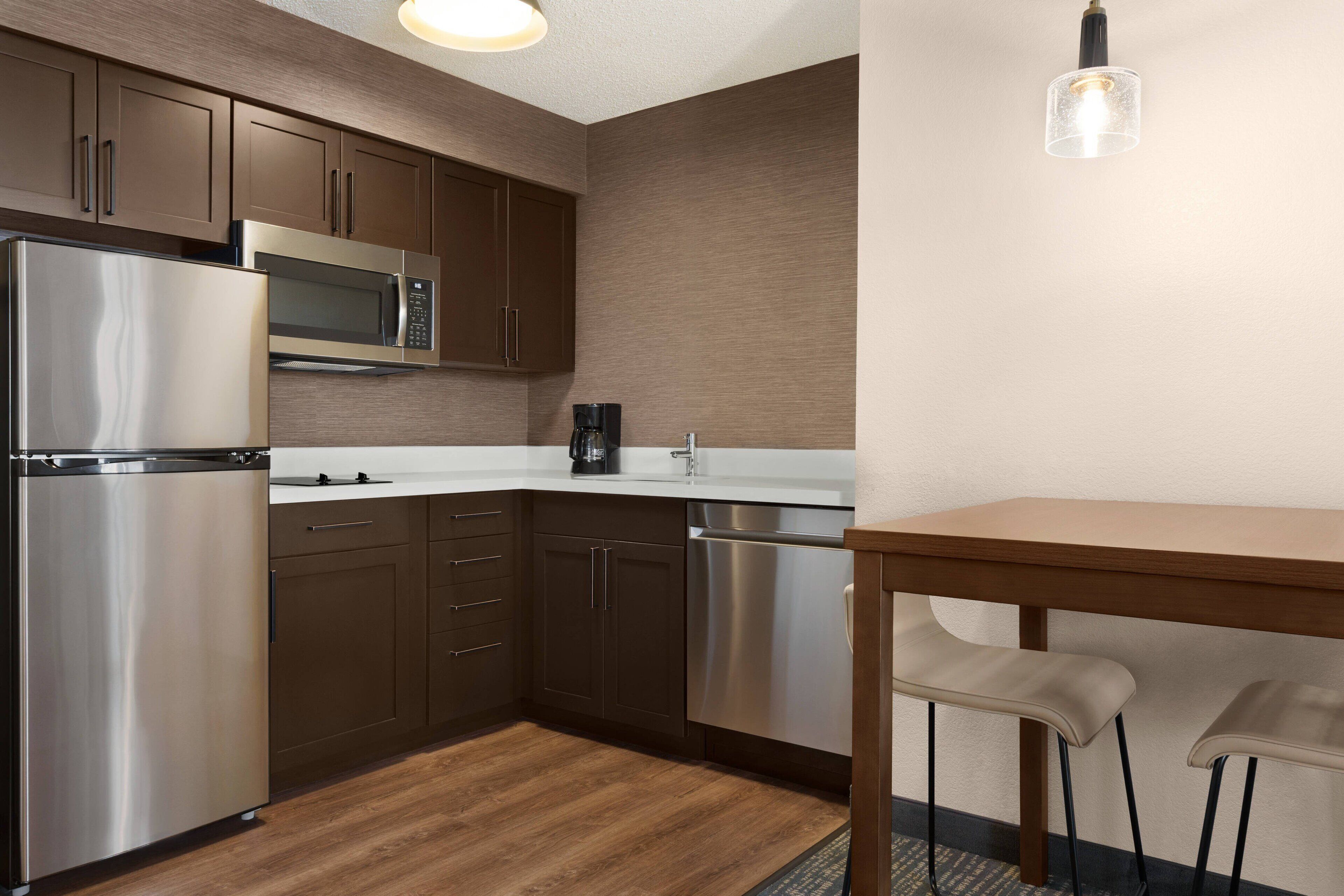 suite, 1 bedroom | private kitchen | full-sized fridge, microwave, stovetop, dishwasher