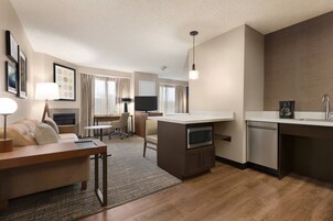 Premium bedding, desk, laptop workspace, blackout drapes