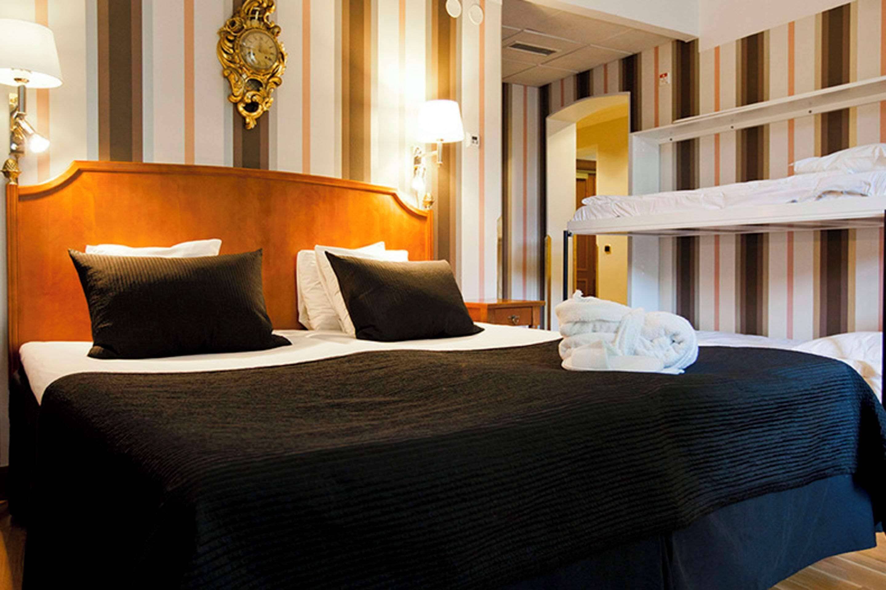 Family Room, Multiple Beds | Minibar, individually decorated, desk, laptop workspace